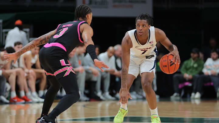 Jan 29, 2025; Coral Gables, Florida, USA; Virginia Cavaliers guard Dai Dai Ames (7) dribbles the basketball as Miami Hurricanes guard Jalil Bethea (3) defends during the first half at Watsco Center. Mandatory Credit: Sam Navarro-Imagn Images Jan 29, 2025; Coral Gables, Florida, USA; Virginia Cavaliers guard Dai Dai Ames (7) dribbles the basketball as Miami Hurricanes guard Jalil Bethea (3) defends during the first half at Watsco Center. Mandatory Credit: Sam Navarro-Imagn Images