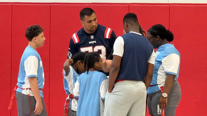 New England Patriots linebacker Christian Elliss coaching up a unified flag football team at the Mattahunt School in Mattapan. New England Patriots linebacker Christian Elliss coaching up a unified flag football team at the Mattahunt School in Mattapan.