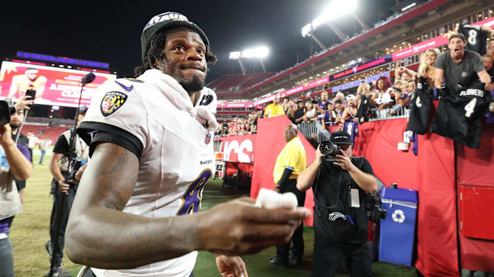 Oct 21, 2024; Tampa, Florida, USA; Baltimore Ravens quarterback Lamar Jackson (8) runs off the field after beating the Tampa Bay Buccaneers at Raymond James Stadium. Mandatory Credit: Nathan Ray Seebeck-Imagn Images