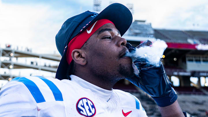 Ole Miss defensive lineman Zxavian Harris (51) smokes a cigar after a college football game between Mississippi State and Ole Miss at Davis Wade Stadium in Starkville, Miss., on Friday, Nov. 28, 2025. Ole Miss defeated Mississippi State 38-19 in the Egg Bowl. Ole Miss defensive lineman Zxavian Harris (51) smokes a cigar after a college football game between Mississippi State and Ole Miss at Davis Wade Stadium in Starkville, Miss., on Friday, Nov. 28, 2025. Ole Miss defeated Mississippi State 38-19 in the Egg Bowl.