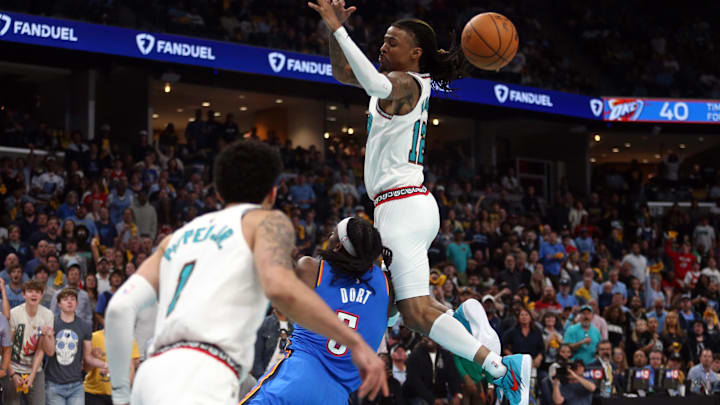 Apr 24, 2025; Memphis, Tennessee, USA; Memphis Grizzlies guard Ja Morant (12) looses control of the ball as he is fouled by Oklahoma City Thunder guard Luguentz Dort (5) during the second quarter during game three for the first round of the 2024 NBA Playoffs at FedExForum. Mandatory Credit: Petre Thomas-Imagn Images Apr 24, 2025; Memphis, Tennessee, USA; Memphis Grizzlies guard Ja Morant (12) looses control of the ball as he is fouled by Oklahoma City Thunder guard Luguentz Dort (5) during the second quarter during game three for the first round of the 2024 NBA Playoffs at FedExForum. Mandatory Credit: Petre Thomas-Imagn Images