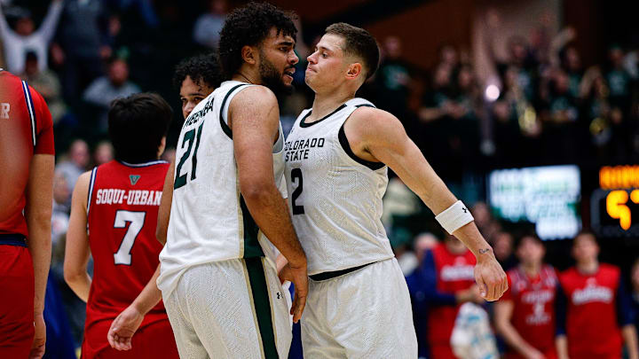 Colorado State Rams guard Brandon Rechsteiner (2) reacts with teammate Rashaan Mbemba.