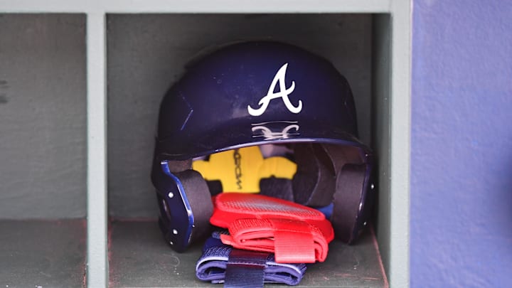 Mar 31, 2024; Philadelphia, Pennsylvania, USA; Atlanta Braves batting helmet inside the dugout before game against the Philadelphia Phillies at Citizens Bank Park. Mandatory Credit: Eric Hartline-Imagn Images