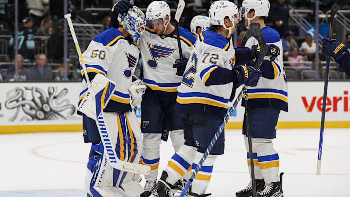 Oct 8, 2024; Seattle, Washington, USA; St. Louis Blues center Radek Faksa (12) embraces goaltender Jordan Binnington (50) after the game against the Seattle Kraken at Climate Pledge Arena. Mandatory Credit: Caean Couto-Imagn Images