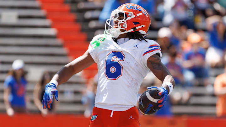 Apr 12, 2025; Gainesville, FL, USA; Florida Gators wide receiver Dallas Wilson (6) reacts after scoring a touchdown during the second half at Ben Hill Griffin Stadium. Mandatory Credit: Matt Pendleton-Imagn Images