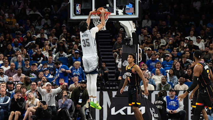 Orlando Magic center Goga Bitadze (35) dunks the ball over Phoenix Suns forward Iso Ighodaro (4) in the third quarter at Kia Center.