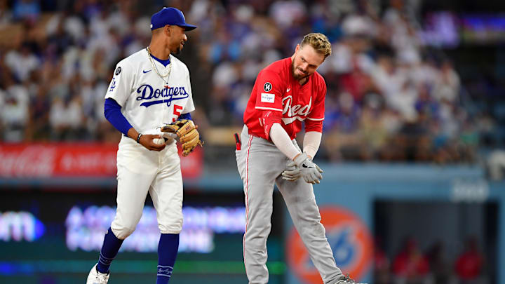 Aug 25, 2025; Los Angeles, California, USA; Cincinnati Reds outfielder Gavin Lux (2) reacts with Los Angeles Dodgers shortstop Mookie Betts (50) after hitting a double in the second inning at Dodger Stadium. Mandatory Credit: Gary A. Vasquez-Imagn Images