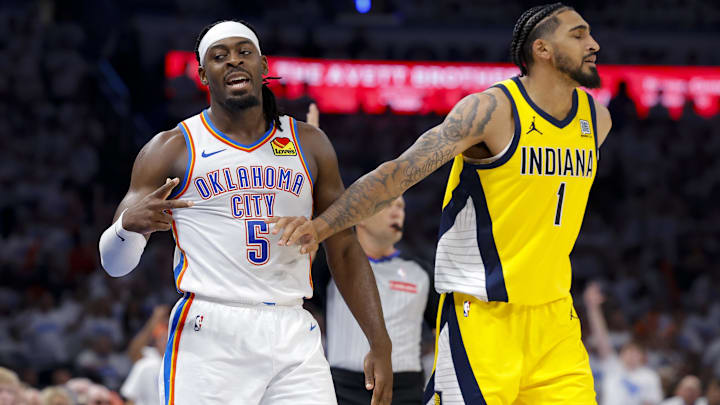 Jun 5, 2025; Oklahoma City, Oklahoma, USA; Oklahoma City Thunder guard Luguentz Dort (5) celebrates making a three point basket as Indiana Pacers forward Obi Toppin (1) looks on during the third quarter during game one of the 2025 NBA Finals at Paycom Center. Mandatory Credit: Alonzo Adams-Imagn Images