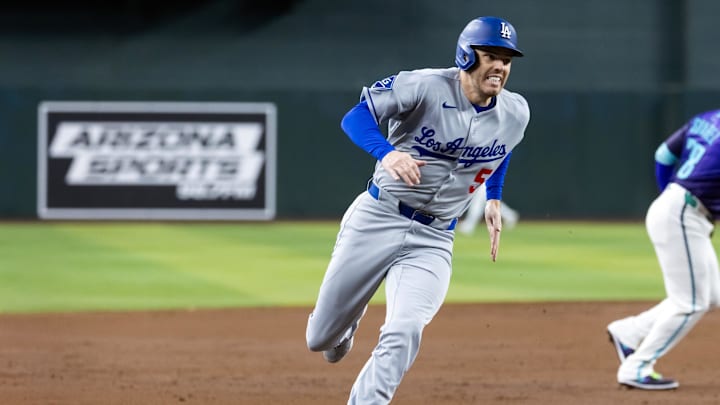 May 9, 2025; Phoenix, Arizona, USA; Los Angeles Dodgers first baseman Freddie Freeman scores in the third inning against the Arizona Diamondbacks at Chase Field. Mandatory Credit: Mark J. Rebilas-Imagn Images