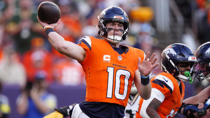 Dec 14, 2025; Denver, Colorado, USA; Denver Broncos quarterback Bo Nix (10) throws downfield during the second quarter against the Green Bay Packers at Empower Field at Mile High. 
