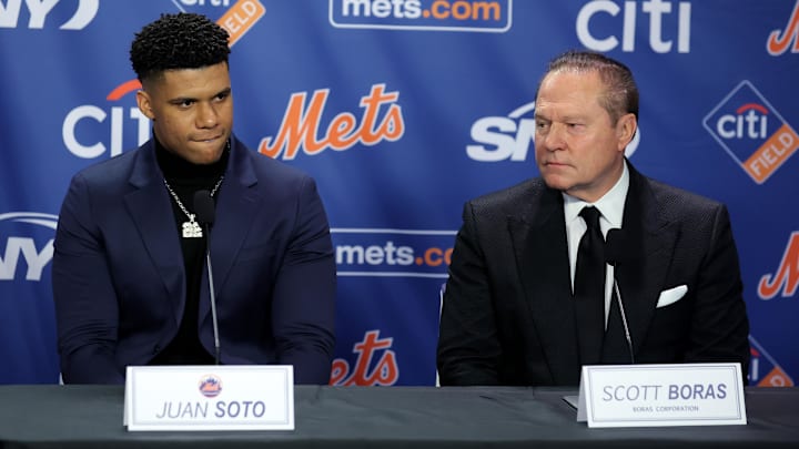 Dec 12, 2024; Flushing, NY, USA; New York Mets right fielder Juan Soto sits with agent Scott Boras during his introductory press conference at Citi Field. Mandatory Credit: Brad Penner-Imagn Images Dec 12, 2024; Flushing, NY, USA; New York Mets right fielder Juan Soto sits with agent Scott Boras during his introductory press conference at Citi Field. Mandatory Credit: Brad Penner-Imagn Images