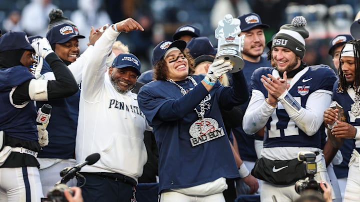 Penn State Nittany Lions wide receiver Trebor Pena (8) holds the David C. Koch MVP Trophy after defeating the Clemson Tigers in the 2025 Pinstripe Bowl at Yankee Stadium. 