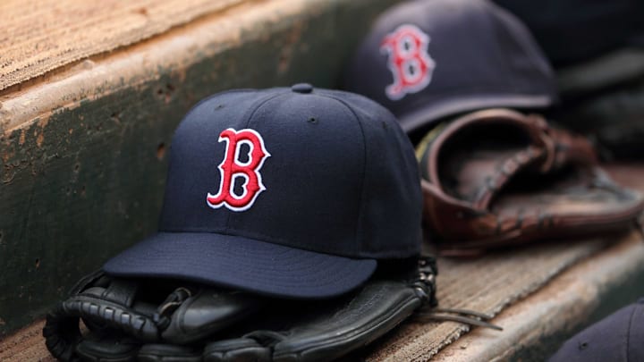 Aug 23, 2011; Arlington, TX, USA; Hats and gloves from the Boston Red Sox team near the edge of the dugout before the game against the Texas Rangers at Rangers Ballpark. Mandatory Credit: Kevin Jairaj-Imagn Images Aug 23, 2011; Arlington, TX, USA; Hats and gloves from the Boston Red Sox team near the edge of the dugout before the game against the Texas Rangers at Rangers Ballpark. Mandatory Credit: Kevin Jairaj-Imagn Images