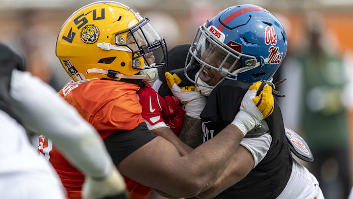 Mississippi's Walter Nolan spars with LSU lineman Miles Frazier during Senior Bowl practice drills. Mississippi's Walter Nolan spars with LSU lineman Miles Frazier during Senior Bowl practice drills.