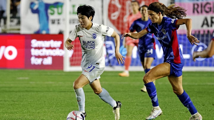 Apr 27, 2024; Cary, North Carolina, USA; Seattle Reign FC midfielder Ji So-Yun (91) moves the ball against North Carolina Courage midfielder Landy Mertz (19) at WakeMed Soccer Park. Mandatory Credit: Jaylynn Nash-USA TODAY Sports