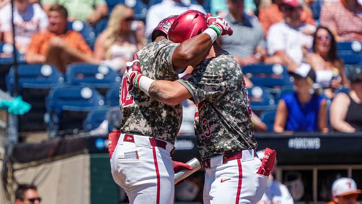 Jun 14, 2026; Omaha, NE, USA; Alabama Crimson Tide designated hitter John Lemm (33) and left fielder Eric Hines (42) embrace after a home run by Lemm in the fourth inning against the Texas Longhorns at Charles Schwab Field. Mandatory Credit: Dylan Widger-Imagn Images Jun 14, 2026; Omaha, NE, USA; Alabama Crimson Tide designated hitter John Lemm (33) and left fielder Eric Hines (42) embrace after a home run by Lemm in the fourth inning against the Texas Longhorns at Charles Schwab Field. Mandatory Credit: Dylan Widger-Imagn Images