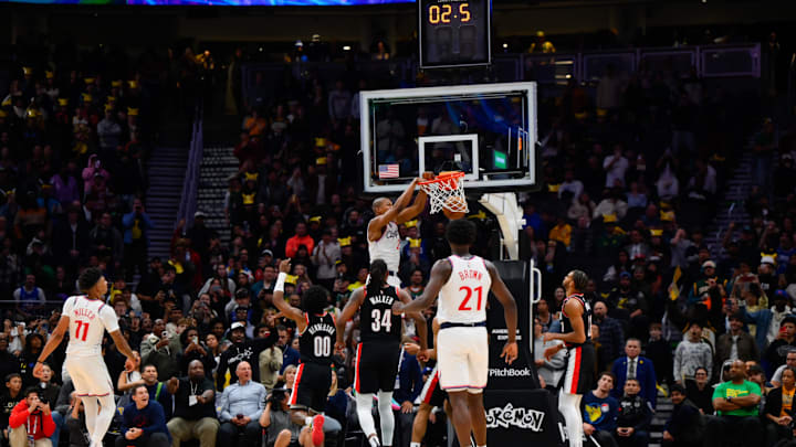 Oct 11, 2024; Seattle, Washington, USA; Los Angeles Clippers forward Kai Jones (23) dunks the ball with 2.5 seconds left in the game to defeat the Portland Trail Blazers at Climate Pledge Arena. Mandatory Credit: Steven Bisig-Imagn Images