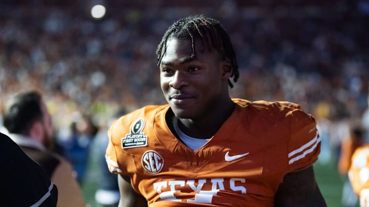 Dec 21, 2024; Austin, Texas, USA; Texas Longhorns linebacker Colin Simmons (11) against the Clemson Tigers during the CFP National playoff first round at Darrell K Royal-Texas Memorial Stadium. Mandatory Credit: Mark J. Rebilas-Imagn Images