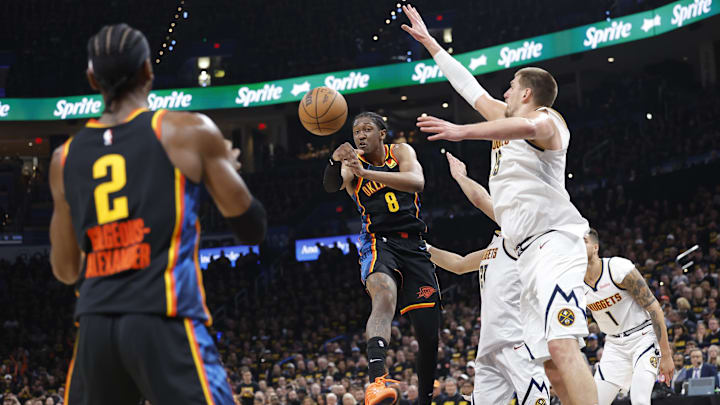 May 7, 2025; Oklahoma City, Oklahoma, USA; Oklahoma City Thunder forward Jalen Williams (8) passes to guard Shai Gilgeous-Alexander (2) as Denver Nuggets center Nikola Jokic (15) defends in the second half during game two of the second round for the 2025 NBA Playoffs at Paycom Center. Mandatory Credit: Alonzo Adams-Imagn Images