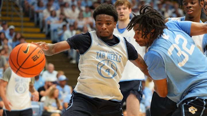 Oct 4, 2025; Charlotte, NC, USA; North Carolina Tar Heels guard Jaydon Young (4) and guard Evan Smith (32) fight for the ball in the second half at Dean E. Smith Center. Mandatory Credit: Bob Donnan-Imagn Images Oct 4, 2025; Charlotte, NC, USA; North Carolina Tar Heels guard Jaydon Young (4) and guard Evan Smith (32) fight for the ball in the second half at Dean E. Smith Center. Mandatory Credit: Bob Donnan-Imagn Images