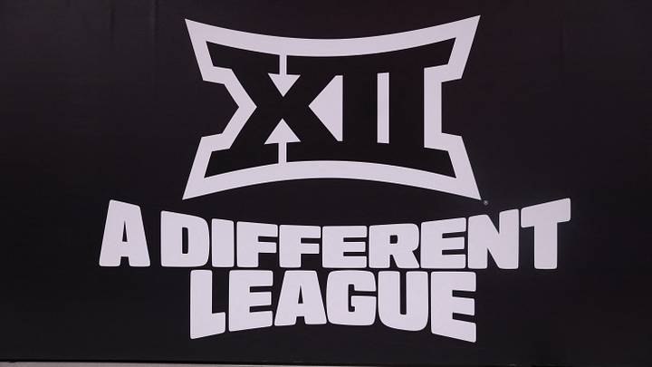 Mar 14, 2026; Kansas City, MO, USA; The Big 12 logo is seen prior to a game between the Arizona Wildcats and the Houston Cougars during the men's Big 12 Conference Tournament Championship at T-Mobile Center. Mandatory Credit: William Purnell Mar 14, 2026; Kansas City, MO, USA; The Big 12 logo is seen prior to a game between the Arizona Wildcats and the Houston Cougars during the men's Big 12 Conference Tournament Championship at T-Mobile Center. Mandatory Credit: William Purnell