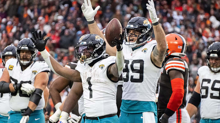 Dec 10, 2023; Cleveland, Ohio, USA; Jacksonville Jaguars running back Travis Etienne Jr. (1) and