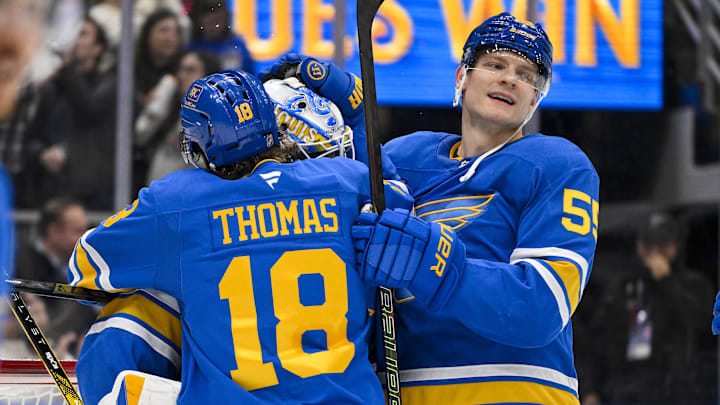 Nov 11, 2025; St. Louis, Missouri, USA; St. Louis Blues goaltender Jordan Binnington (50) center Robert Thomas (18) and defenseman Colton Parayko (55) celebrate after the Blues defeated the Calgary Flames at Enterprise Center. Mandatory Credit: Jeff Curry-Imagn Images