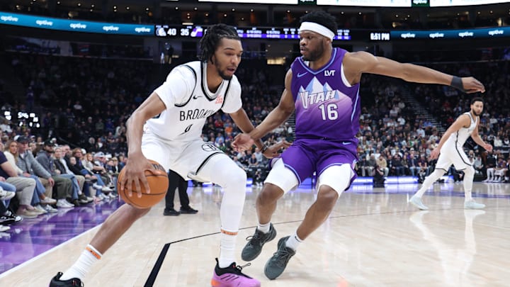 Jan 12, 2025; Salt Lake City, Utah, USA; Brooklyn Nets guard De'Anthony Melton (8) dribbles against Utah Jazz guard Elijah Harkless (16) during the second quarter at Delta Center. Mandatory Credit: Rob Gray-Imagn Images Jan 12, 2025; Salt Lake City, Utah, USA; Brooklyn Nets guard De'Anthony Melton (8) dribbles against Utah Jazz guard Elijah Harkless (16) during the second quarter at Delta Center. Mandatory Credit: Rob Gray-Imagn Images