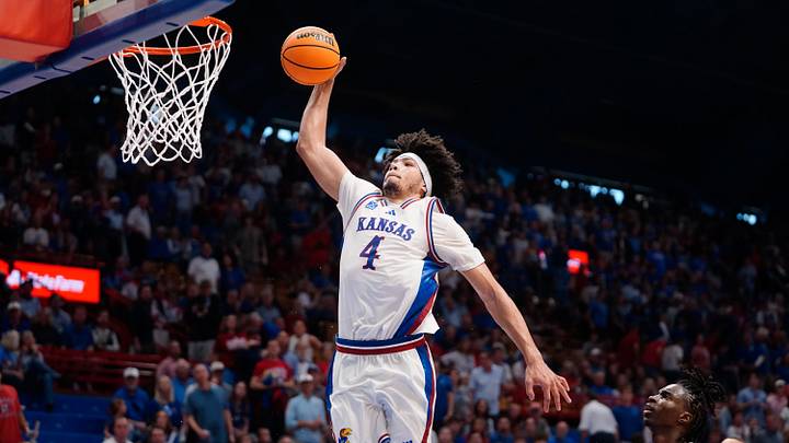 Kansas Jayhawks guard Tyran Stokes (4) jumps for a dunk against Duke Blue Devils during the exhibition game inside Allen Fieldhouse in Lawrence, Kansas on Oct. 25, 2026.