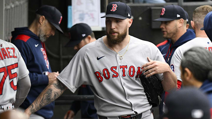 Boston Red Sox pitcher Garrett Crochet (35) high fives teammates after he pitched against the Chicago White Sox during the first inning at Guaranteed Rate Field.