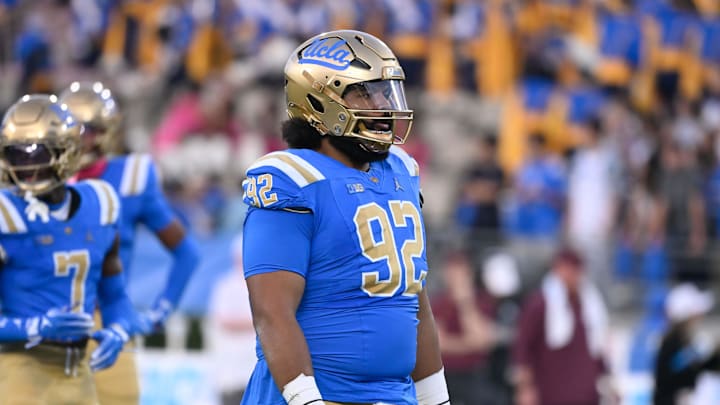 Oct 12, 2024; Pasadena, California, USA; UCLA Bruins defensive lineman Siale Taupaki (92) during the first quarter against the Minnesota Golden Gophers at Rose Bowl. Mandatory Credit: Robert Hanashiro-Imagn Images