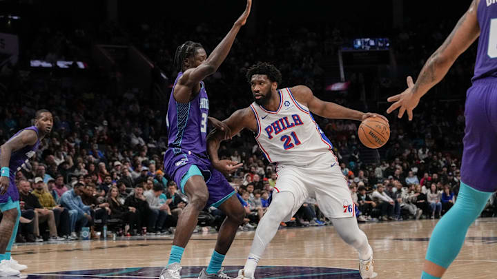 Jan 20, 2024; Charlotte, North Carolina, USA; Philadelphia 76ers center Joel Embiid (21) handles the ball against Charlotte Hornets center Nathan Mensah (31) during the second quarter at Spectrum Center. Mandatory Credit: Jim Dedmon-Imagn Images Jan 20, 2024; Charlotte, North Carolina, USA; Philadelphia 76ers center Joel Embiid (21) handles the ball against Charlotte Hornets center Nathan Mensah (31) during the second quarter at Spectrum Center. Mandatory Credit: Jim Dedmon-Imagn Images