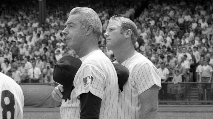 August 8, 1970; New York, NY, USA; Yankees Old Timers Joe DiMaggio and Mickey Mantle pause for the national anthem