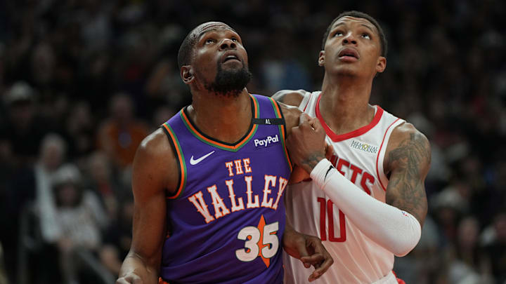 Mar 30, 2025; Phoenix, Arizona, USA; Phoenix Suns forward Kevin Durant (35) and Houston Rockets forward Jabari Smith Jr. (10) fight for position in the first half at Footprint Center. Mandatory Credit: Rick Scuteri-Imagn Images