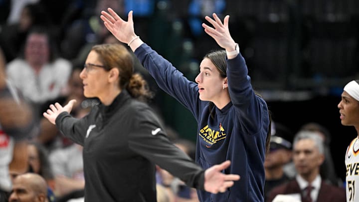 Aug 1, 2025; Dallas, Texas, USA;  Indiana Fever head coach Stephanie White and guard Caitlin Clark (22) react to a call during the first half against the Dallas Wings at the American Airlines Center. Mandatory Credit: Jerome Miron-Imagn Images