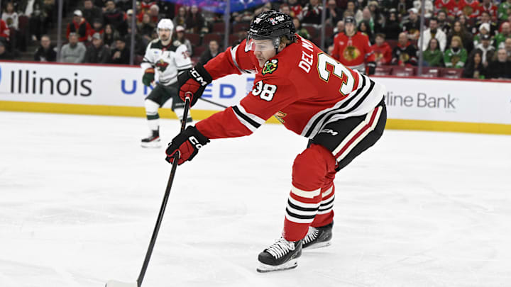 Mar 17, 2026; Chicago, Illinois, USA;  Chicago Blackhawks defenseman Ethan del Mastro (38) moves the puck against the Minnesota Wild during the first period at United Center. Mandatory Credit: Matt Marton-Imagn Images
