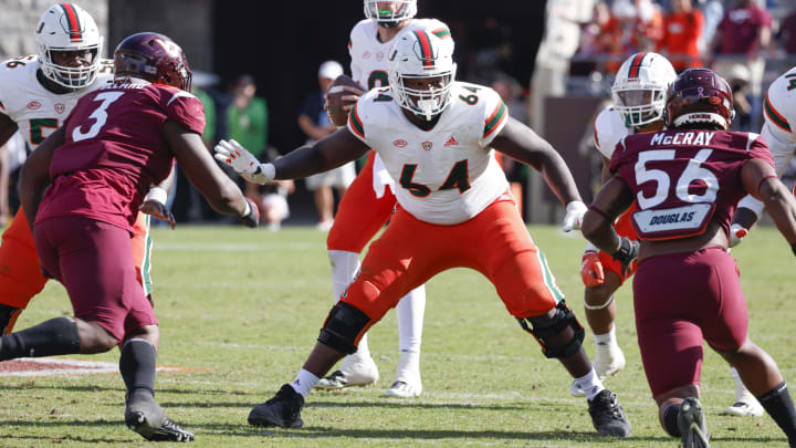 Oct 15, 2022; Blacksburg, Virginia, USA;  Miami Hurricanes offensive lineman Jalen Rivers (64) guards the line against Virginia Tech Hokies defensive linemen Norell Pollard (3) and C.J. McCray (56) during the second half at Lane Stadium. Mandatory Credit: Reinhold Matay-USA TODAY Sports