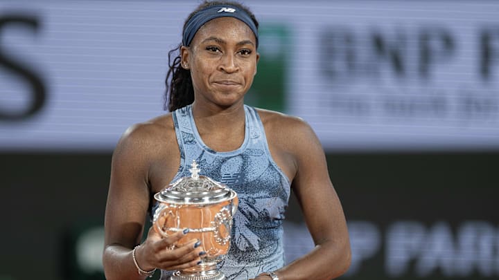 Coco Gauff of the United States poses with the trophy after winning the womenís singles final against Aryna Sabalenka on day 14 at Roland Garros Stadium.
