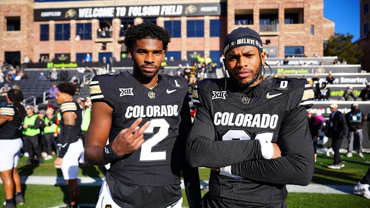 Nov 29, 2024; Boulder, Colorado, USA; Colorado Buffaloes quarterback Shedeur Sanders (2) and safety Shilo Sanders (21) before the game against the Oklahoma State Cowboys at Folsom Field. Mandatory Credit: Ron Chenoy-Imagn Images
