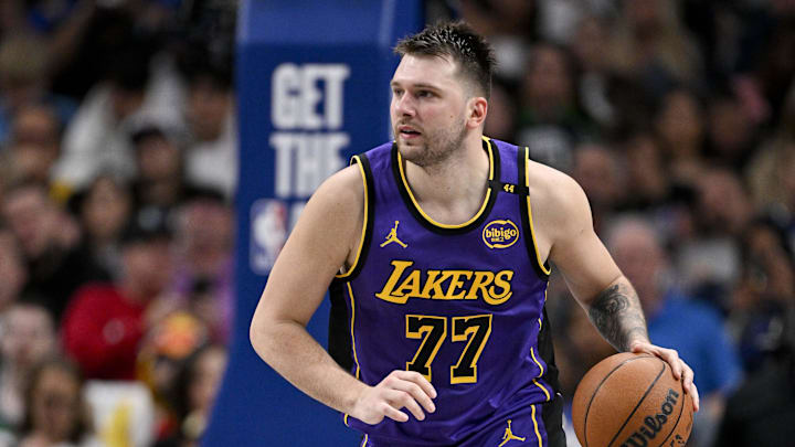 Apr 9, 2025; Dallas, Texas, USA; Los Angeles Lakers guard Luka Doncic (77) brings the ball up court against the Dallas Mavericks during the third quarter at the American Airlines Center. Mandatory Credit: Jerome Miron-Imagn Images Apr 9, 2025; Dallas, Texas, USA; Los Angeles Lakers guard Luka Doncic (77) brings the ball up court against the Dallas Mavericks during the third quarter at the American Airlines Center. Mandatory Credit: Jerome Miron-Imagn Images