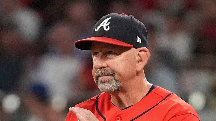 Oct 1, 2026; Cumberland, Georgia, USA;  Atlanta Braves manager Walt Weiss (22) reacts while walking to the mound for a pitching change against the Philadelphia Phillies during the sixth inning in game three of the Wildcard round for the 2026 MLB Playoffs at Truist Field.  Mandatory Credit: Dale Zanine-Imagn Images