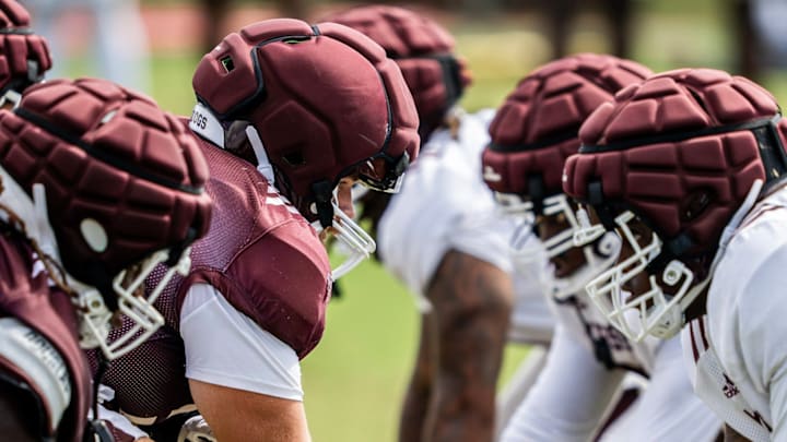 Mississippi State offensive and defensive lines square off during a preseason football practice.