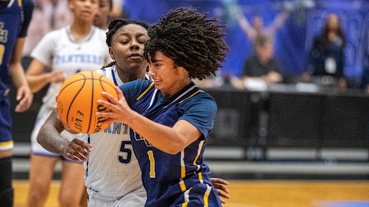 Winter Haven Blue Devils (1) Jaeden Williams drives by Dr. Phillips Panthers (5) Trinity Turner during the FHSAA 7A Girls State semifinal game at the RP Funding Center in Lakeland Fl. Friday March 8, 2024. Winter Haven fell 65-62 to Dr. Phillips.
Ernst Peters/The Ledger