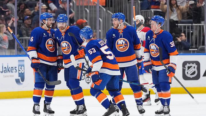 Apr 12, 2026; Elmont, New York, USA; New York Islanders center Casey Cizikas (53) celebrates a goal with defenseman Ryan Pulock (6), defenseman Scott Mayfield (24), center Marc Gatcomb (16) and center Kyle MacLean (32) against the Montreal Canadiens in the third period at UBS Arena. Mandatory Credit: Alexander Wohl-Imagn Images