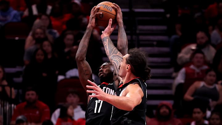 Nov 22, 2024; Houston, Texas, USA; Houston Rockets forward Tari Eason (17) and center Steven Adams (12) battle for a rebound against the Portland Trailblazers during the fourth quarter at Toyota Center. Mandatory Credit: Erik Williams-Imagn Images