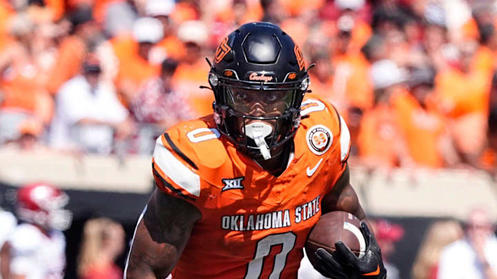Oklahoma State's Ollie Gordon II (0) rushes for a touchdown in the double overtime of the college football game between the Oklahoma State Cowboys and the Arkansas Razorbacks at Boone Pickens Stadium in Stillwater, Okla.,, Saturday, Sept., 7, 2024.