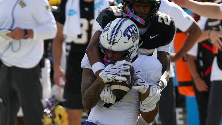 A TCU receiver secures a catch while a UCF defender makes contact during the Horned Frogs’ Big 12 road game in Orlando. A TCU receiver secures a catch while a UCF defender makes contact during the Horned Frogs’ Big 12 road game in Orlando.