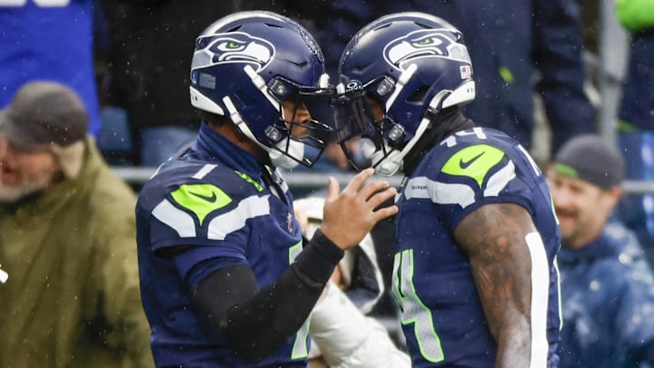 Dec 22, 2024; Seattle, Washington, USA; Seattle Seahawks quarterback Geno Smith (7) celebrates with Seattle Seahawks wide receiver DK Metcalf (14) following a touchdown pass to Metcalf during the second quarter against the Minnesota Vikings at Lumen Field. Mandatory Credit: Joe Nicholson-Imagn Images Dec 22, 2024; Seattle, Washington, USA; Seattle Seahawks quarterback Geno Smith (7) celebrates with Seattle Seahawks wide receiver DK Metcalf (14) following a touchdown pass to Metcalf during the second quarter against the Minnesota Vikings at Lumen Field. Mandatory Credit: Joe Nicholson-Imagn Images
