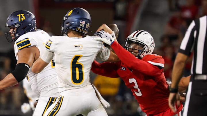 Sep 7, 2024; Tucson, Arizona, USA; Arizona Wildcats defensive lineman Tre Smith (3) forces Northern Arizona Lumberjack quarterback Ty Pennington (6) to fumble the ball during the fourth quarter at Arizona Stadium. Mandatory Credit: Aryanna Frank-Imagn Images Sep 7, 2024; Tucson, Arizona, USA; Arizona Wildcats defensive lineman Tre Smith (3) forces Northern Arizona Lumberjack quarterback Ty Pennington (6) to fumble the ball during the fourth quarter at Arizona Stadium. Mandatory Credit: Aryanna Frank-Imagn Images