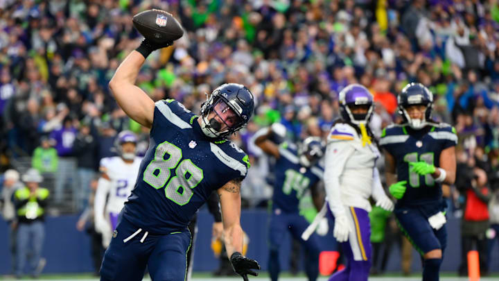 Dec 22, 2024; Seattle, Washington, USA; Seattle Seahawks tight end AJ Barner (88) spikes the ball after scoring a touchdown against the Minnesota Vikings during the second half at Lumen Field.